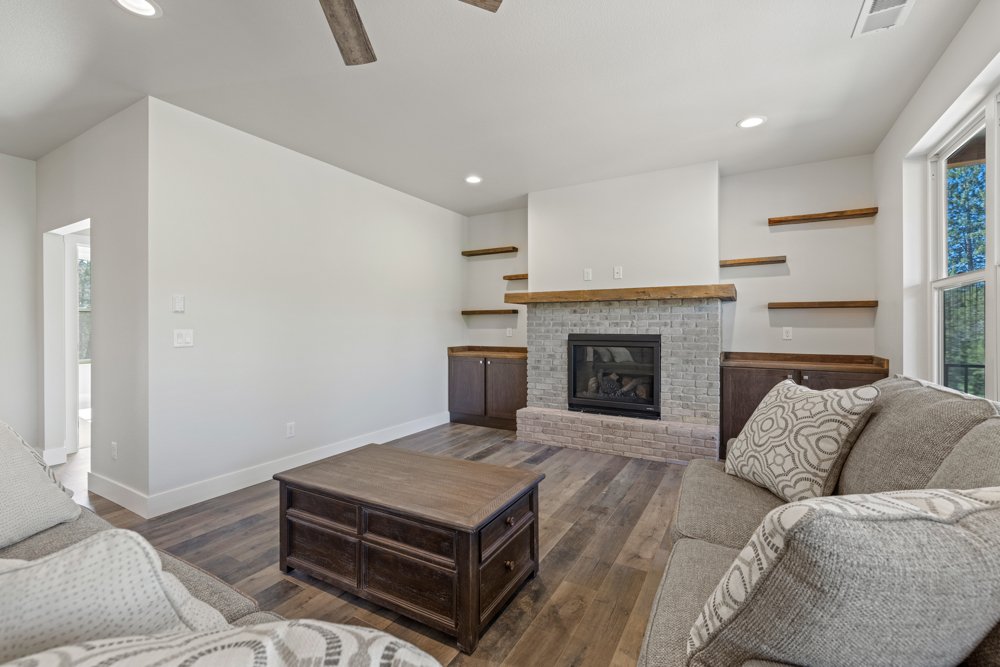 Living room with brick fireplace