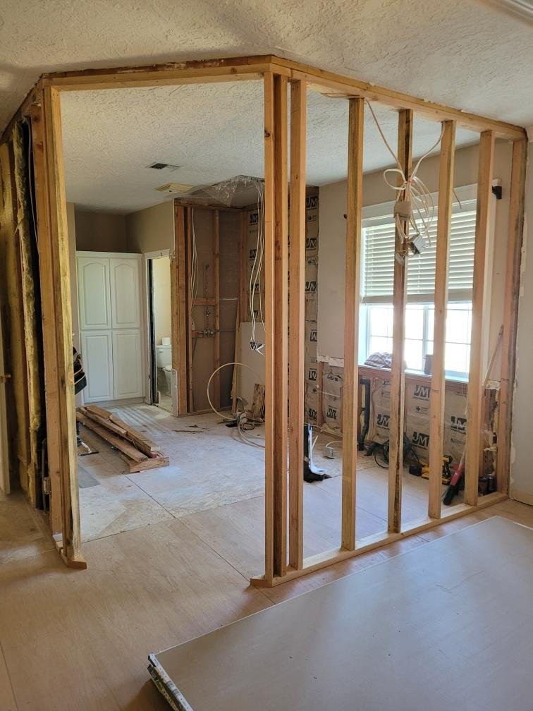 Exposed wall framing during bathroom renovation
