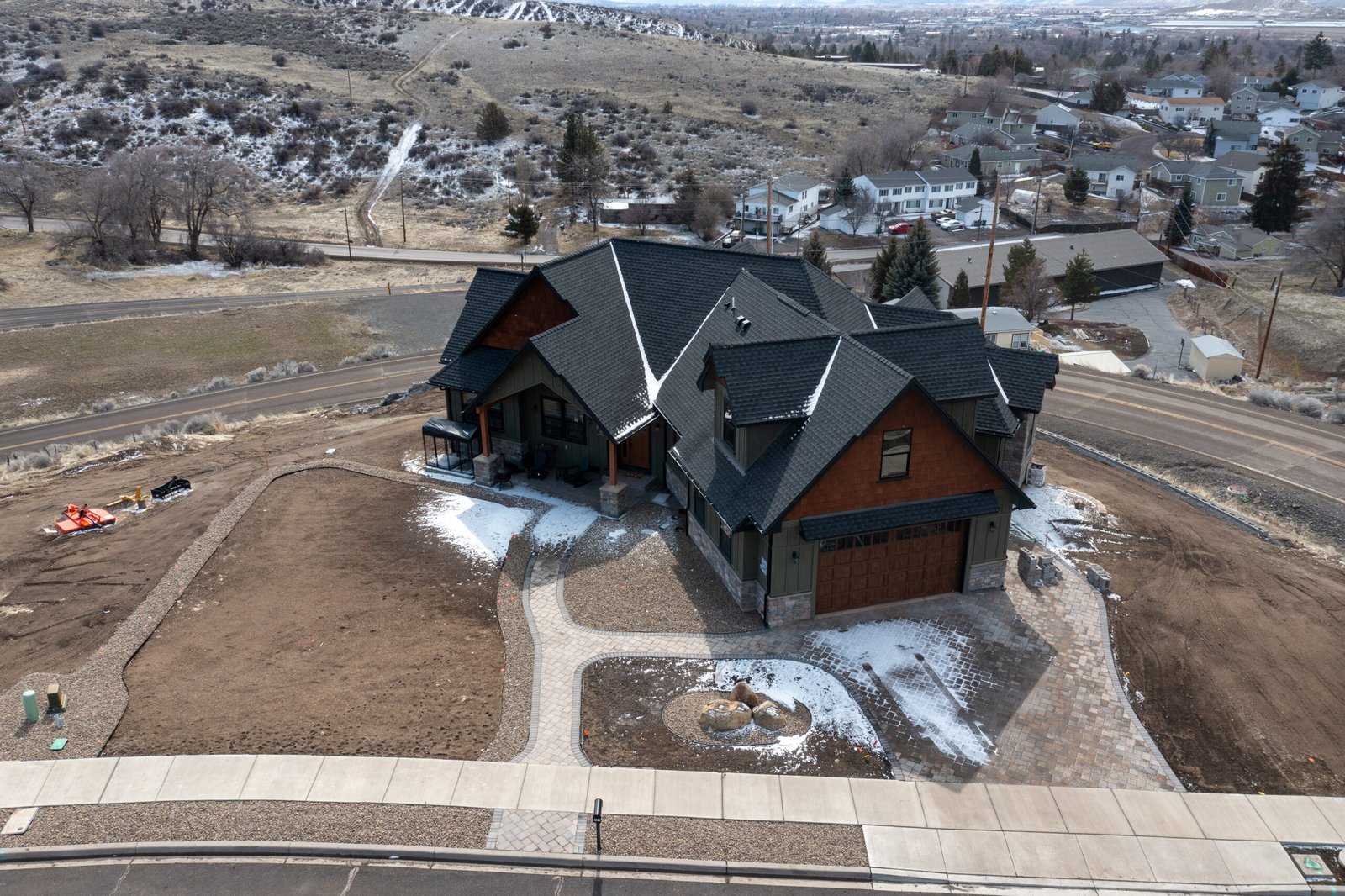 Elevated front view of the craftsman home and property