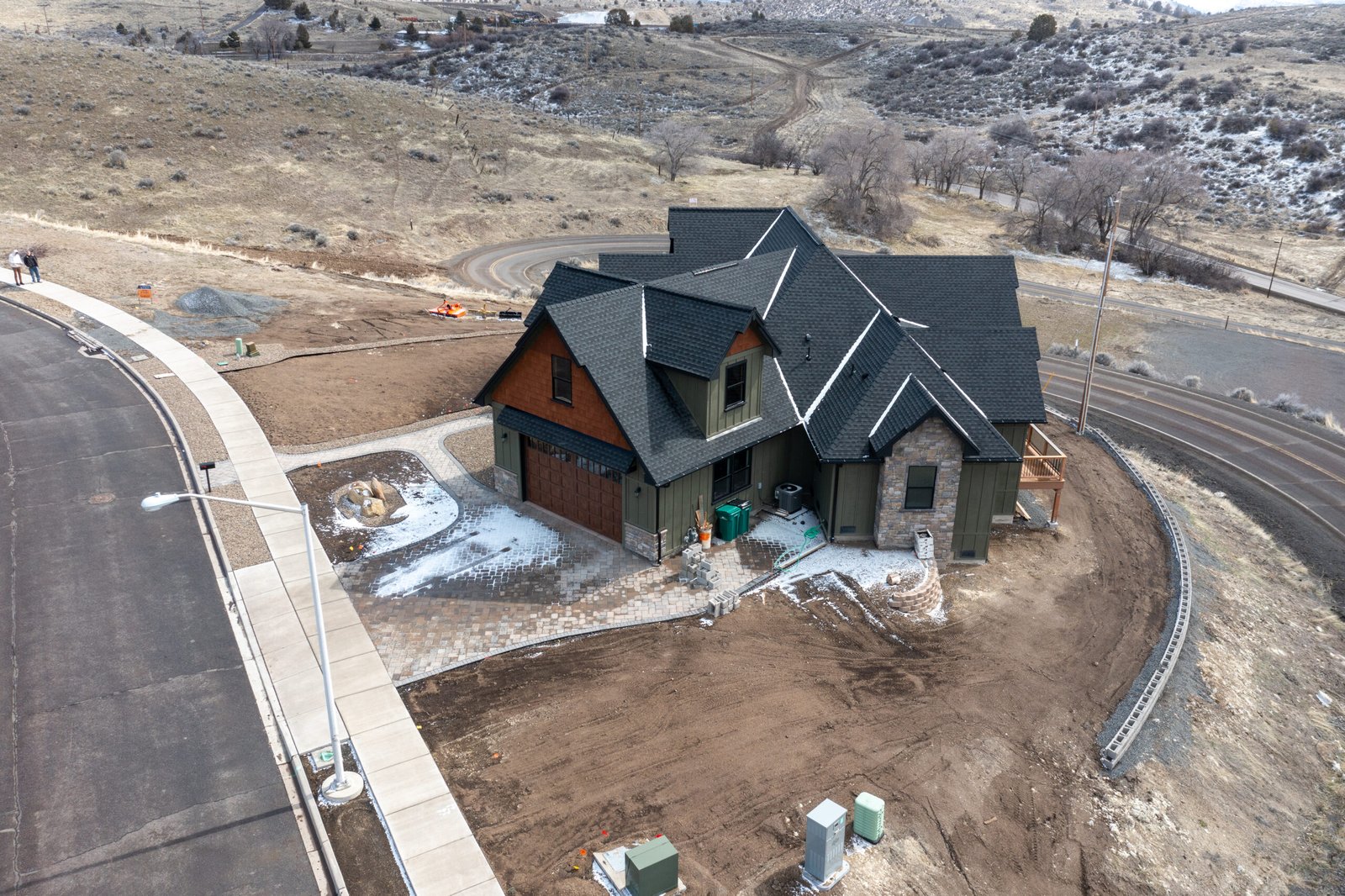 Side view of the craftsman home and driveway
