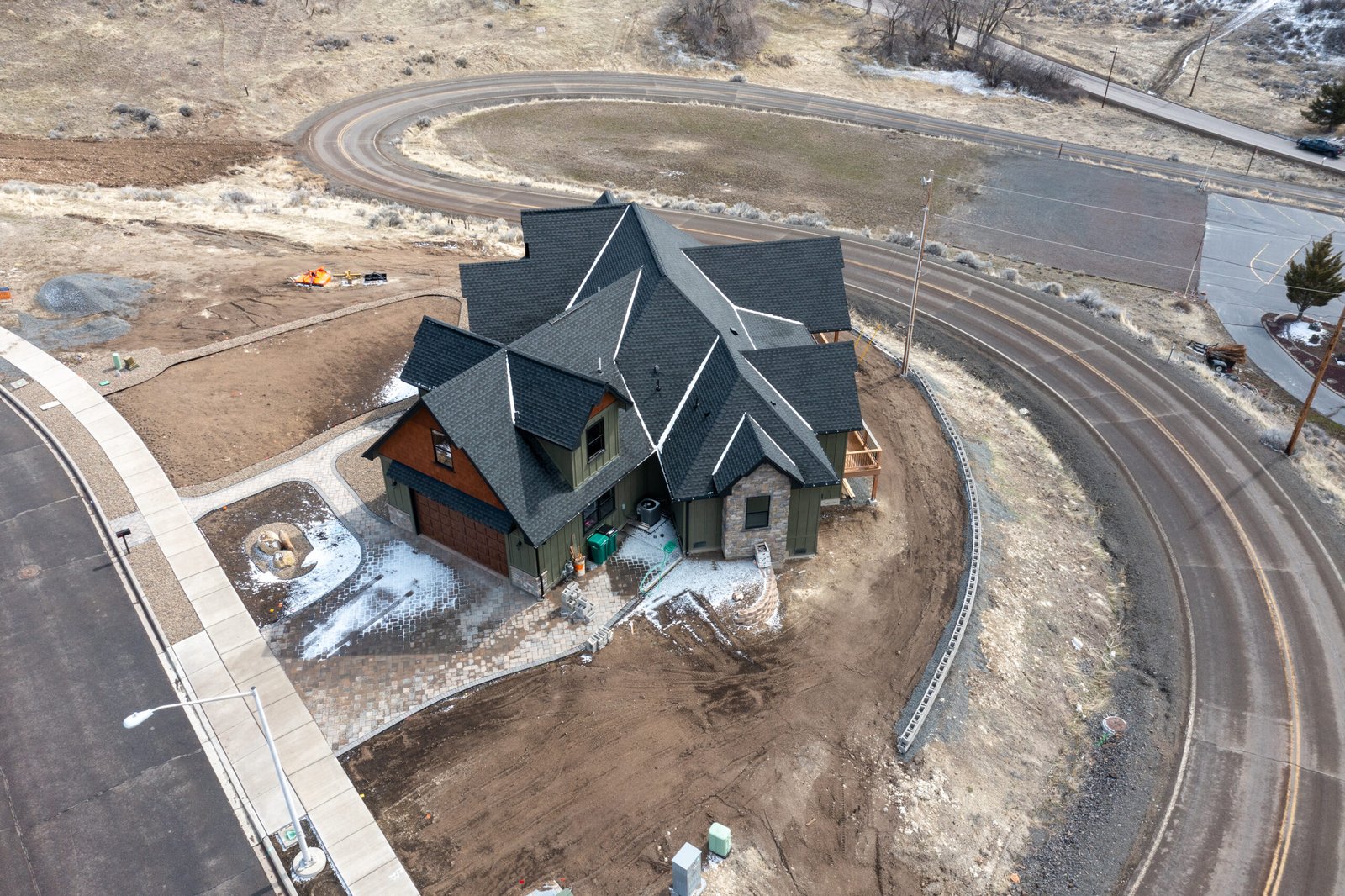 Aerial view of the craftsman home from the road