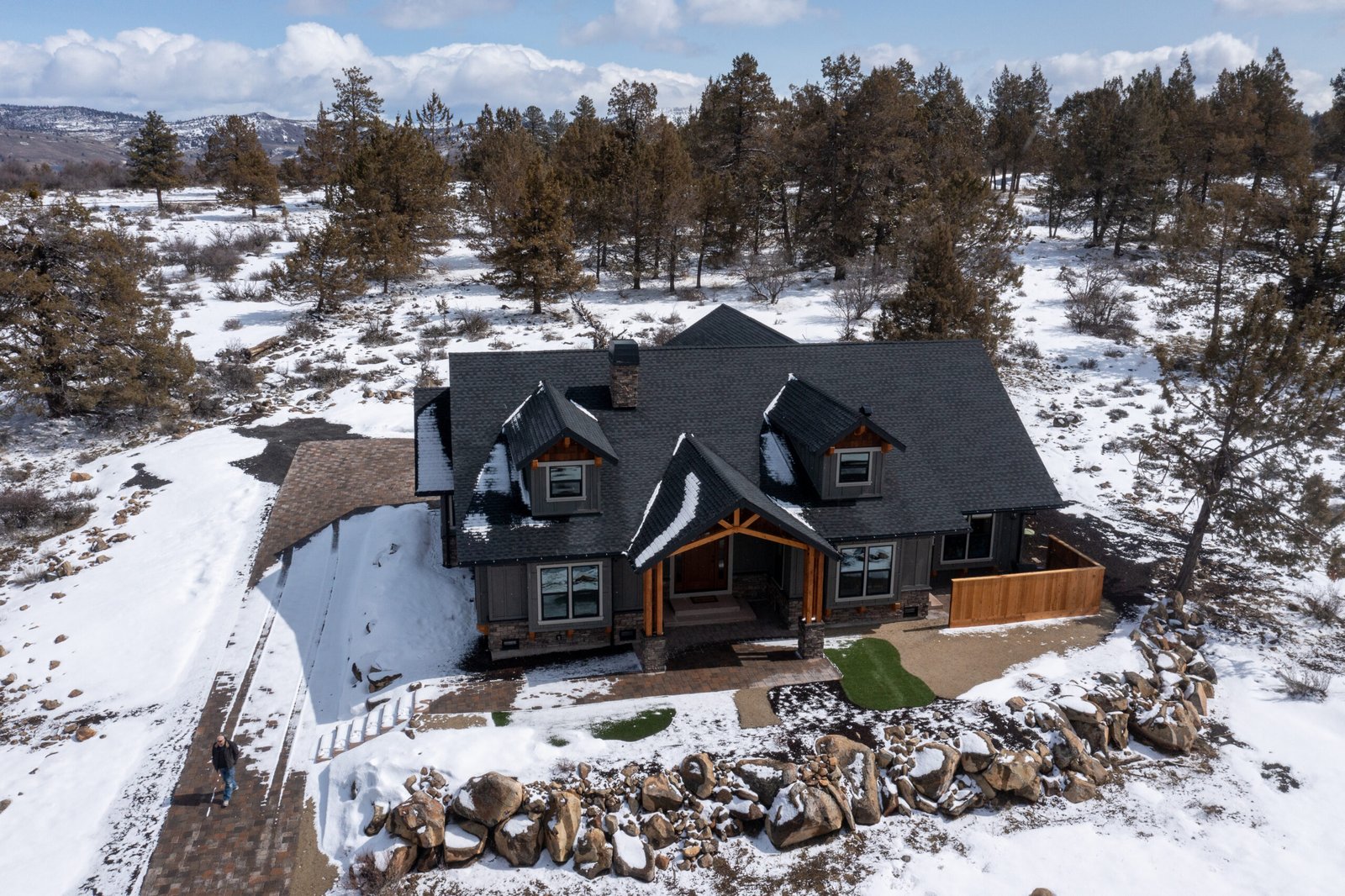 Aerial view of the Ridgewater custom home in snow