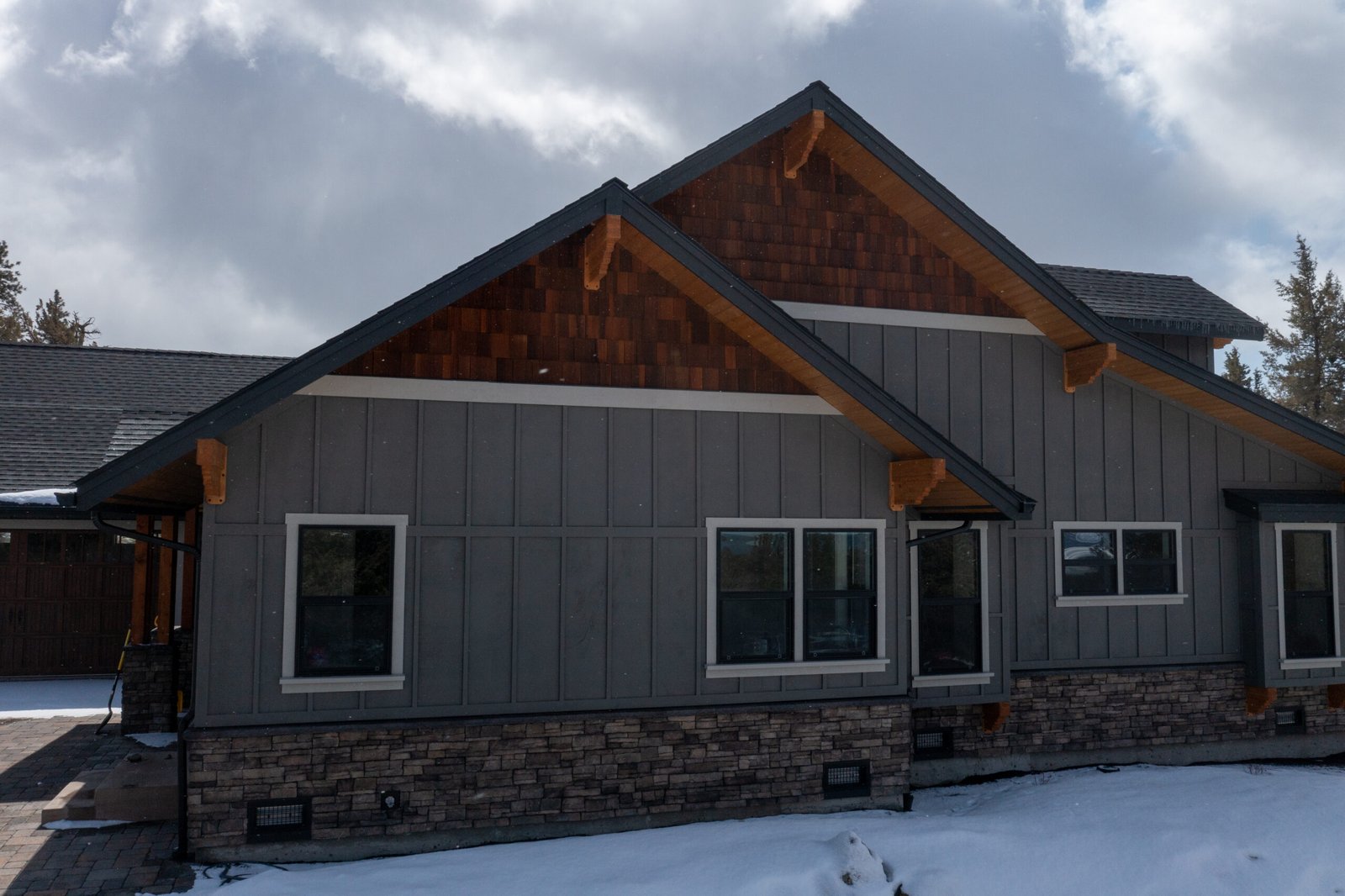 Side exterior of the Ridgewater home in snow