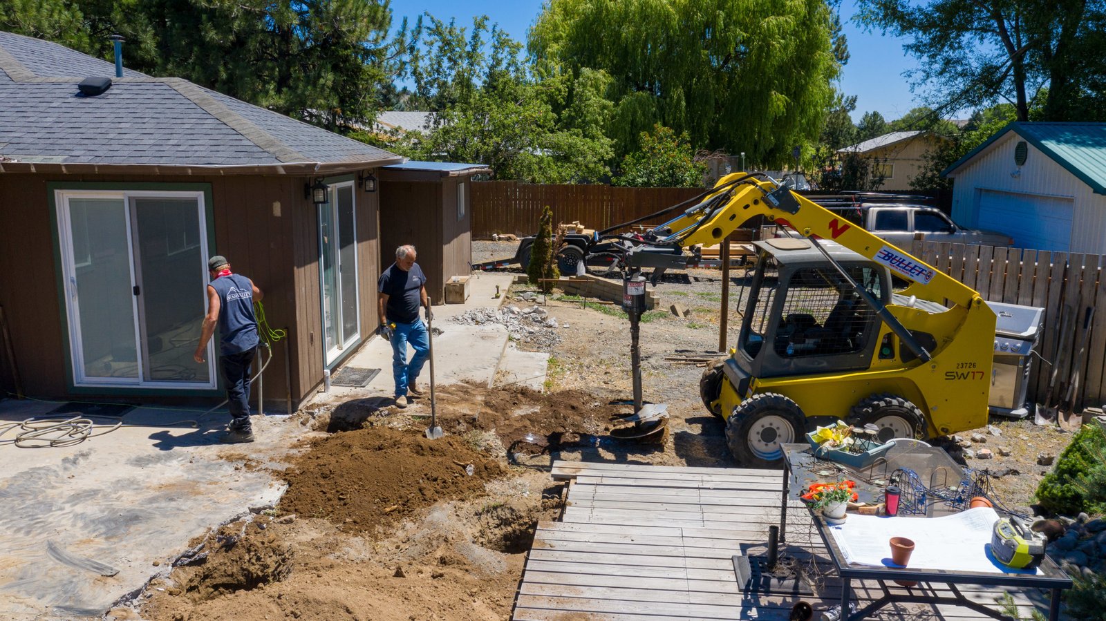 Excavation work beside the home before patio construction