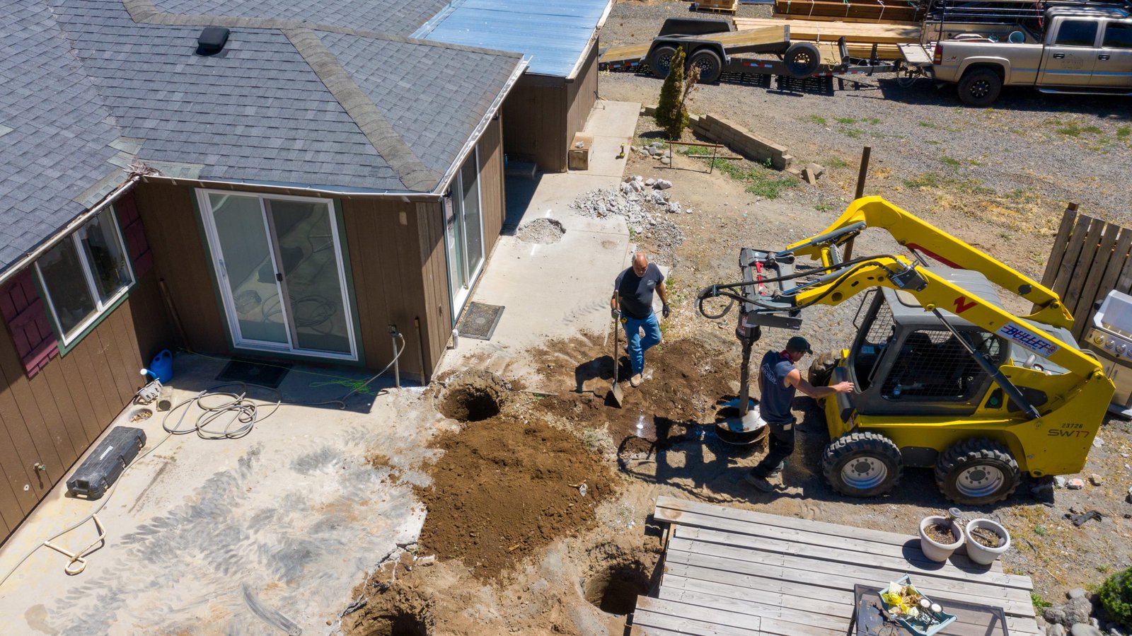 Crew and equipment preparing the patio area