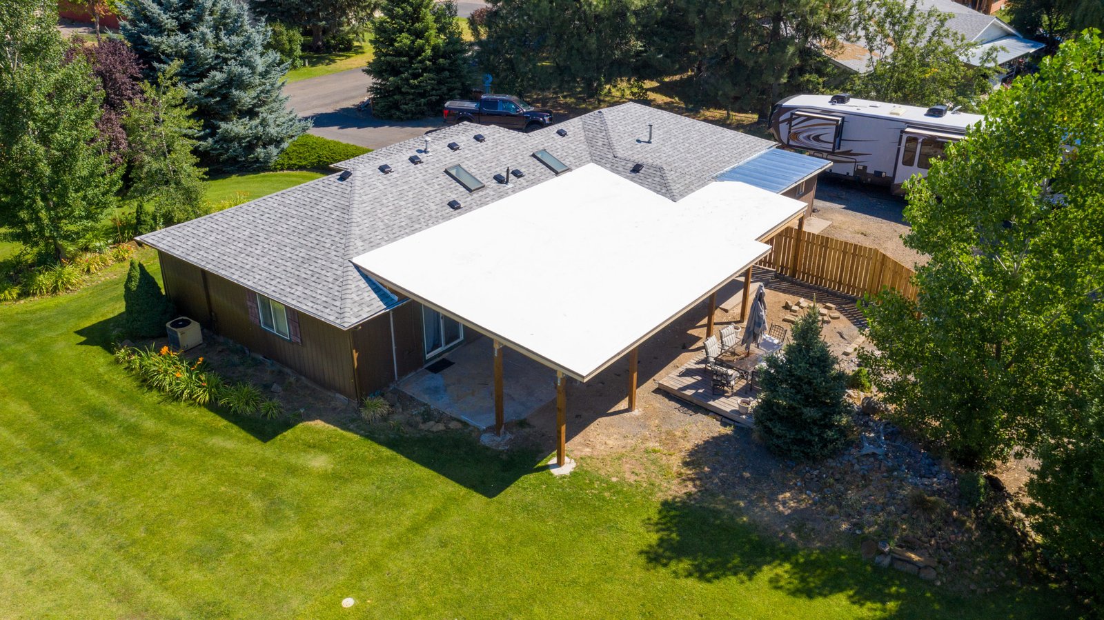 Aerial view of the completed white patio roof