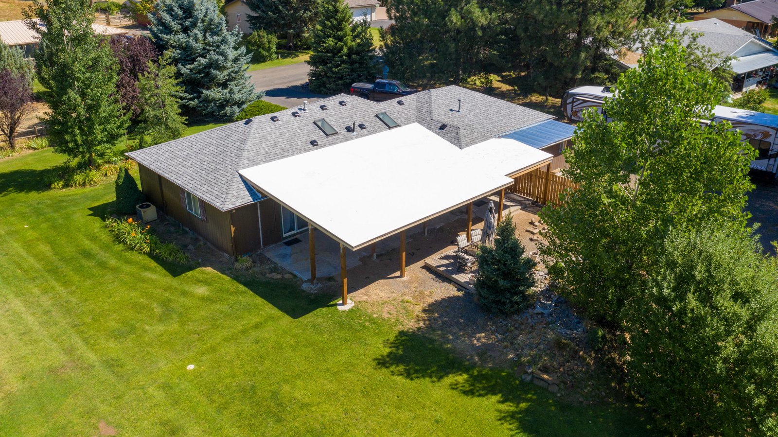 Finished patio roof beside the home and lawn