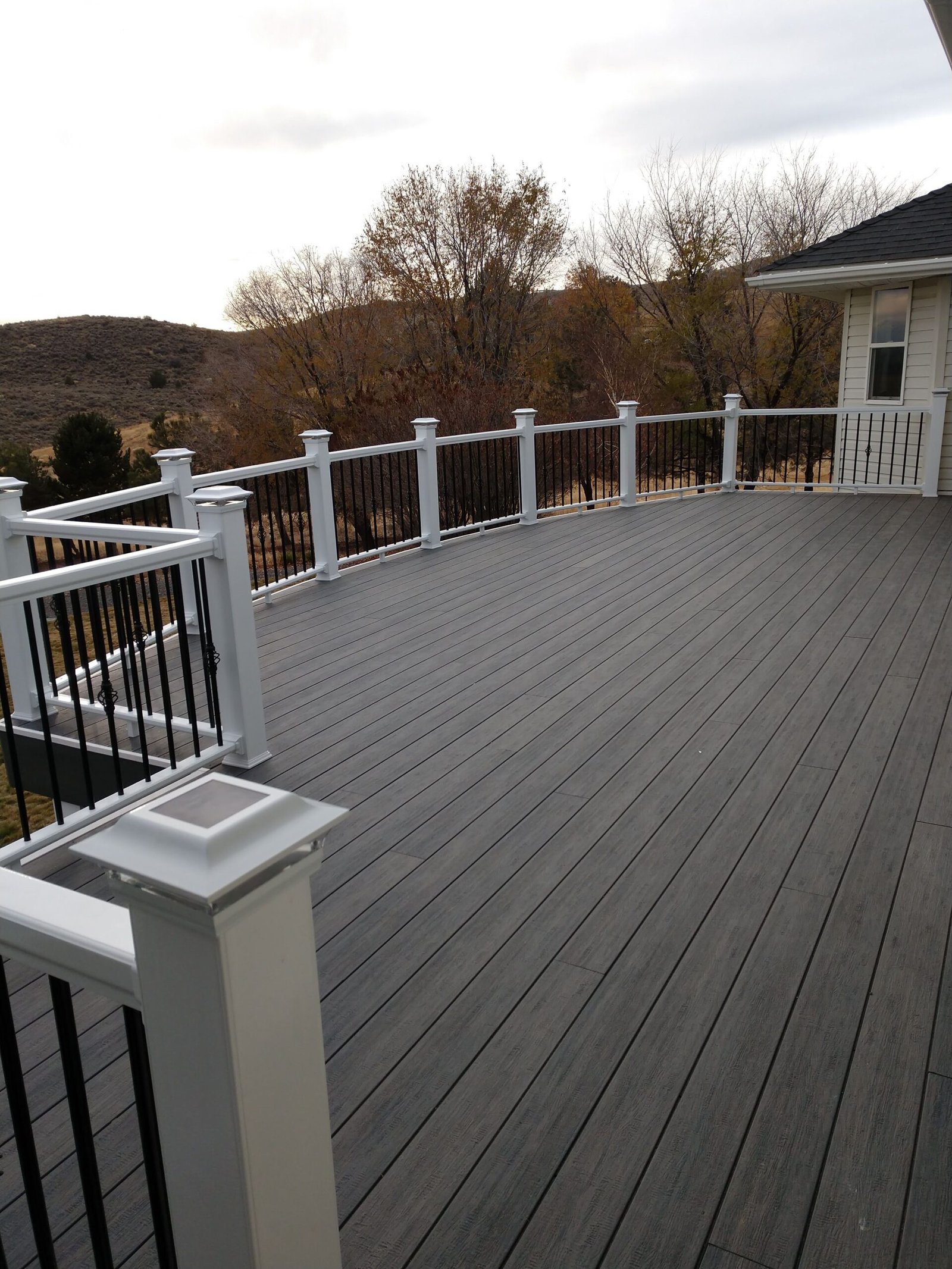 Deck surface with railing overlooking the yard