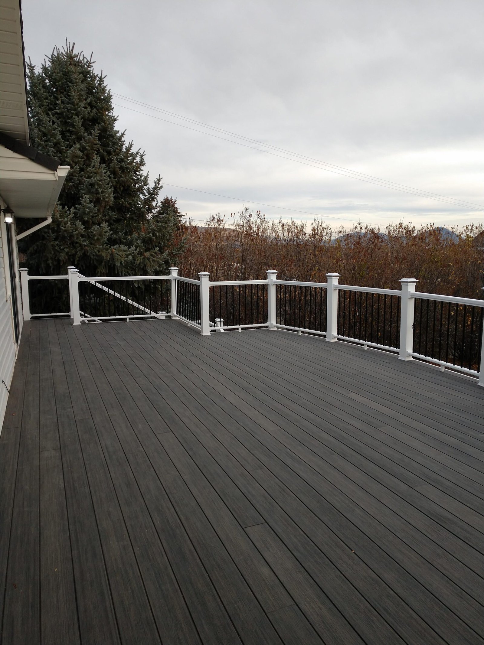 Wide deck surface and white railing
