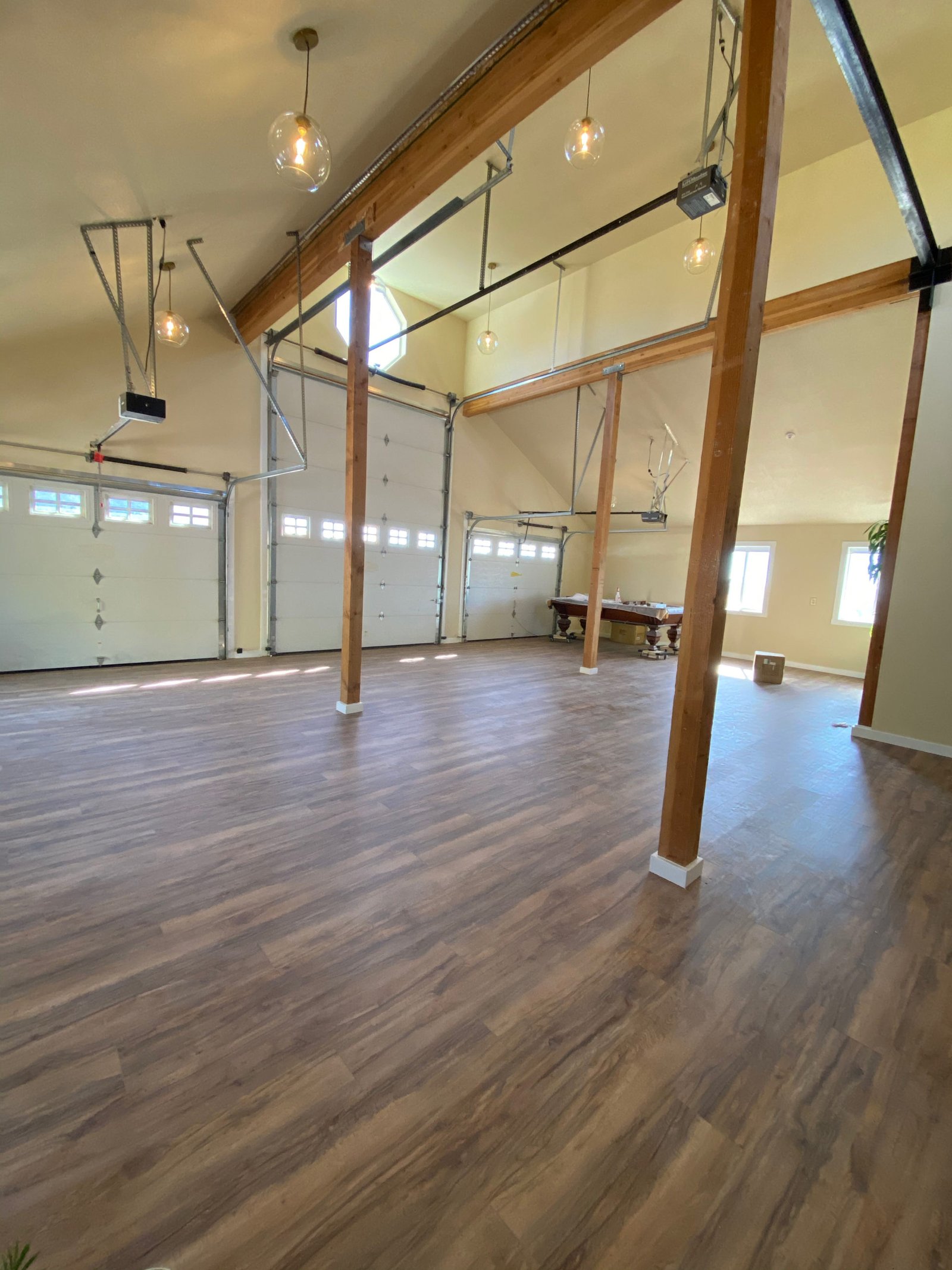Wide studio interior with exposed wood beams