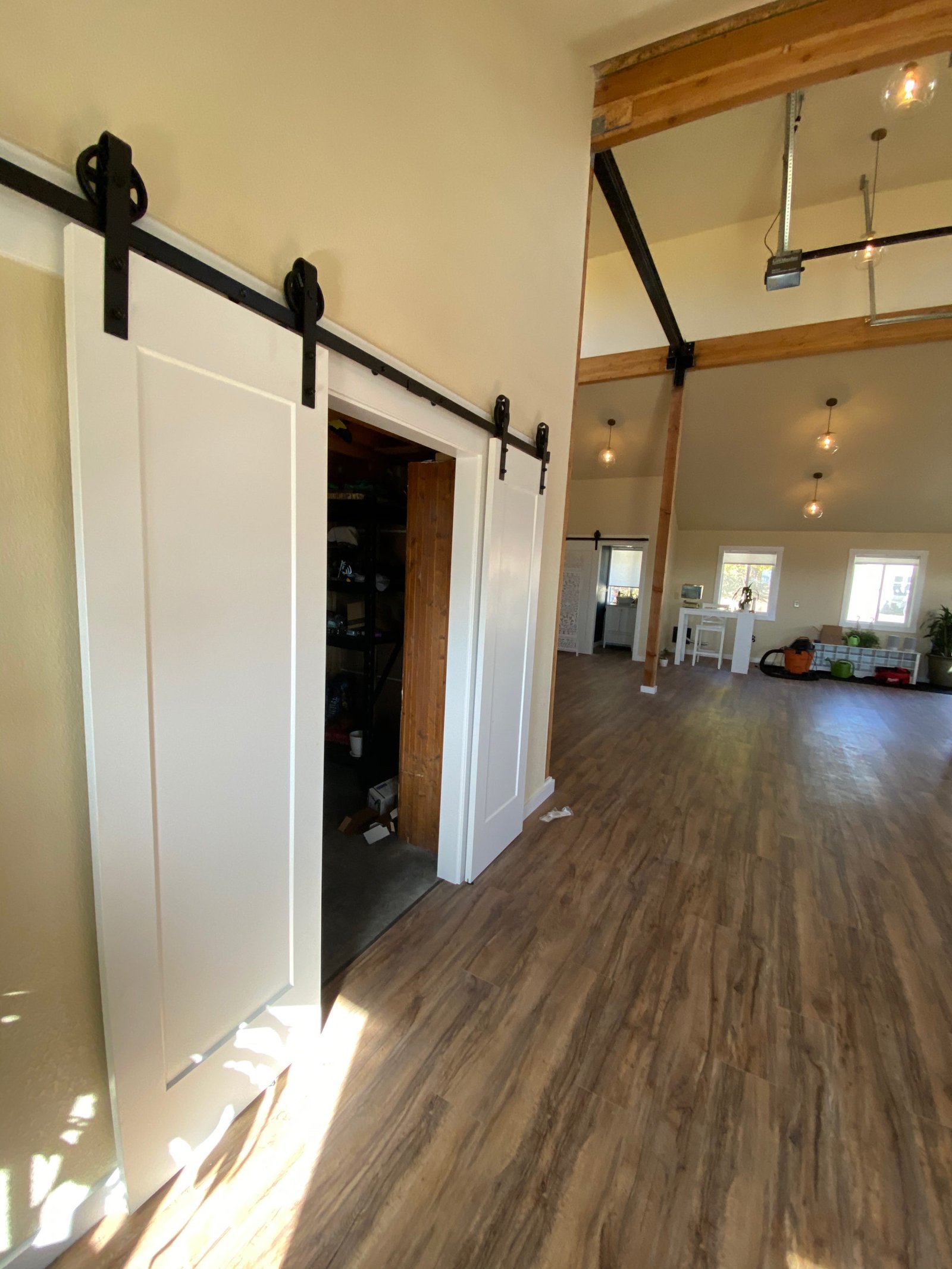 Open barn door leading into the studio