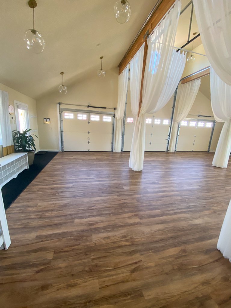 Yoga studio floor and draped curtains
