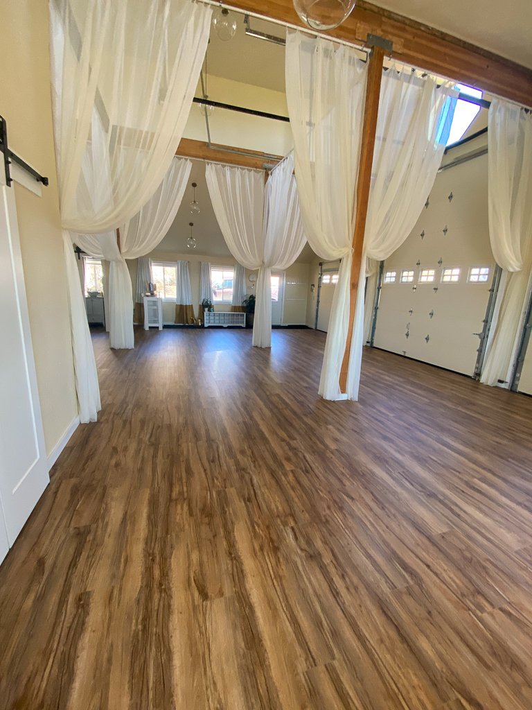 Finished yoga studio with hanging curtains
